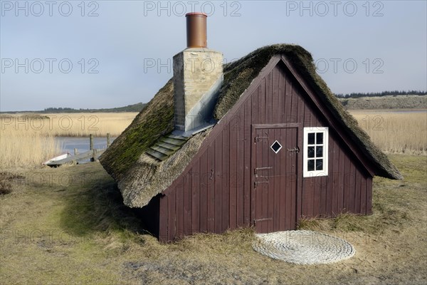 Old fishing hut with a thatched roof