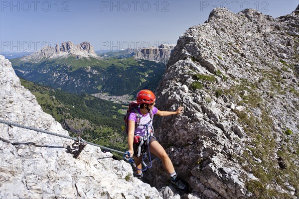 Climber ascending on the Via ferrata dei Finanzieri to the top of Colac