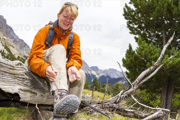 Woman lacing her hiking boots