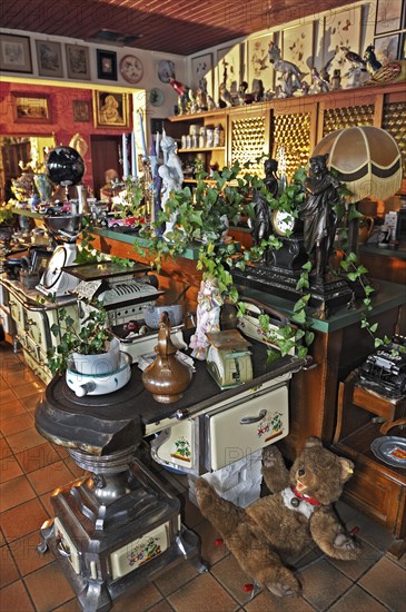 Various old stoves and knick-knacks in a private collection