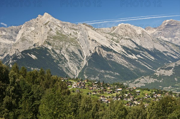 View from Haute-Nendaz over the Rhone Valley towards the summit of Haut de Cry Mountain in the Bernese Alps