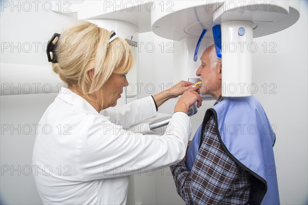 Man being prepared for an X-ray of his teeth
