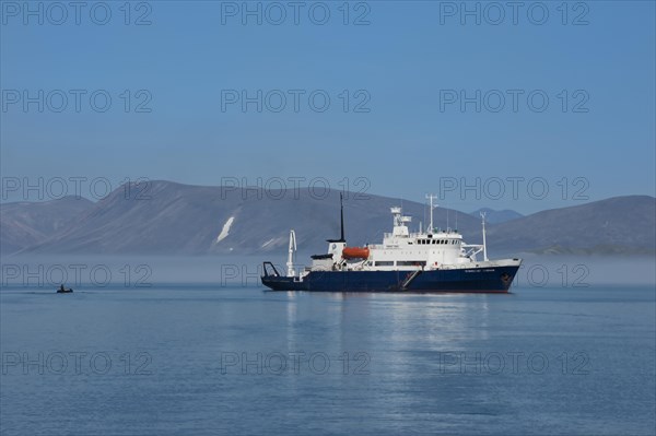 Tourist boat anchored in front of Yttygran Island