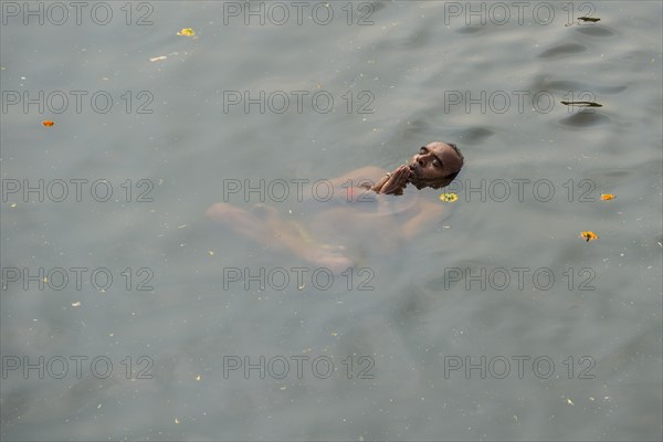 A man is performing padmasana