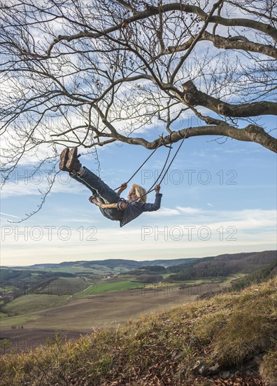 Boy on an improvised swing