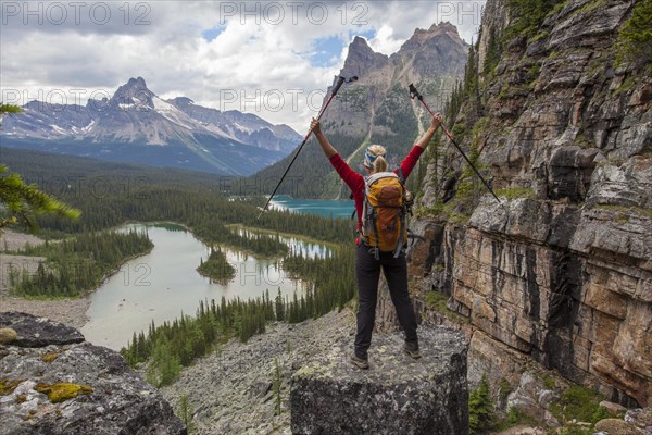 Young woman with hiking sticks