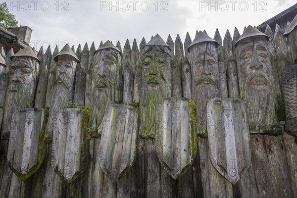 Wooden warrior figures at the entrance