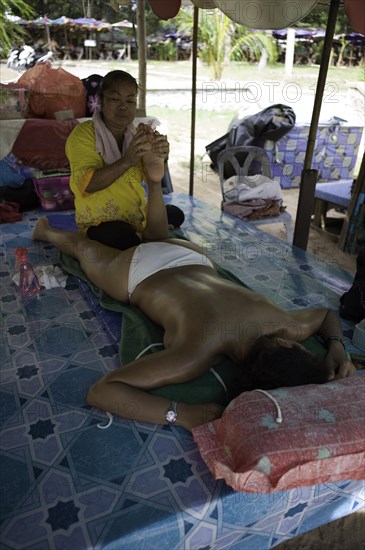 Traditional Thai massage at a beach