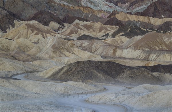 Road through the badlands of the 'Twenty Mule Team Canyon' at dawn