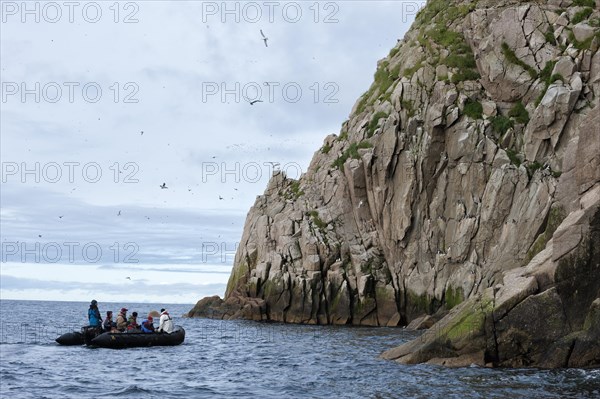 A boat with tourists off Cape Achen