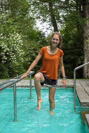 Young woman in the Kneipp basin