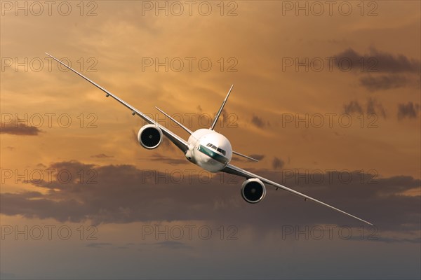 Cathay Pacific Boeing 777-367 ER in flight in the evening light
