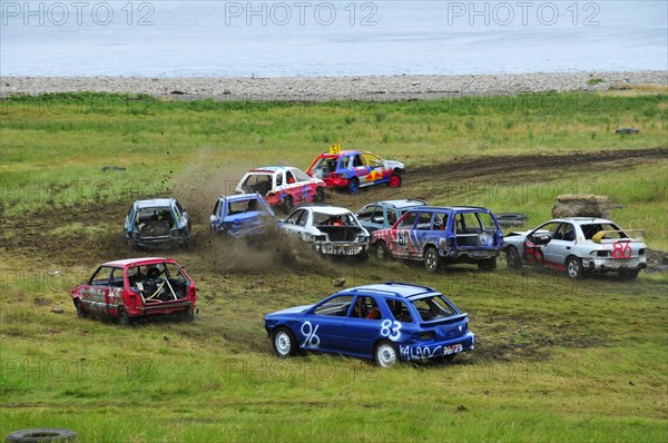 Stock car race on a meadow at the beach near Golspie