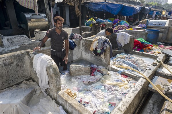 Labourers are washing clothes at Mahalaxmi Dhobi Ghat