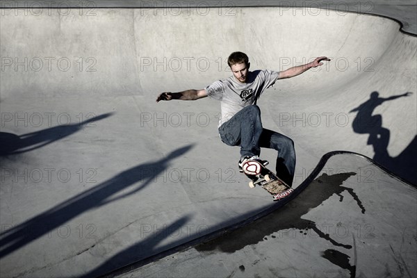 Skateboarder skating in a skate pool