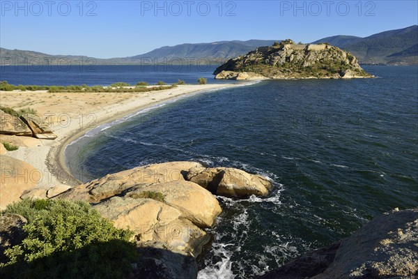 Island with castle on the north shore of Bafa Lake Nature Park