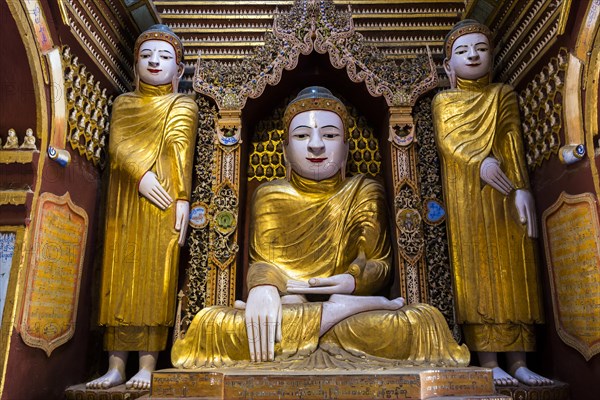 Seated and standing Buddha statues