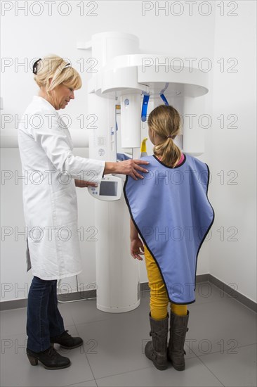 Girl being prepared for an x-ray of her teeth