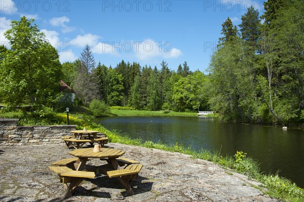 Tables and benches by the lake