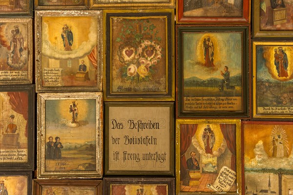 Old votive offerings in the cloister around the Shrine of Our Lady of Altotting