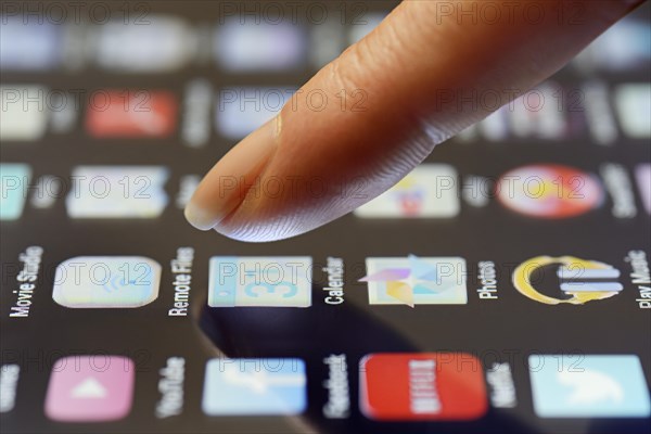 App being selected by a finger on a touchscreen