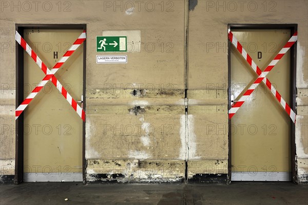 Blocked ladies and gents toilets in the empty shipping hall of a former department store