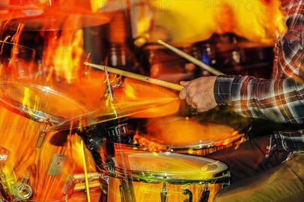 Hands of a drummer playing the drums