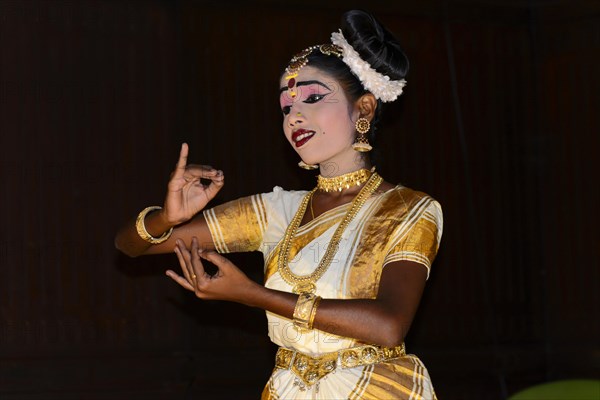 Fully made-up and costumed Kathakali dancer during a performance