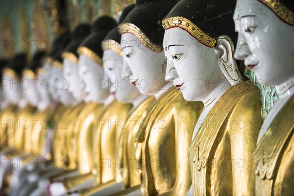 Many seated Buddha sculptures