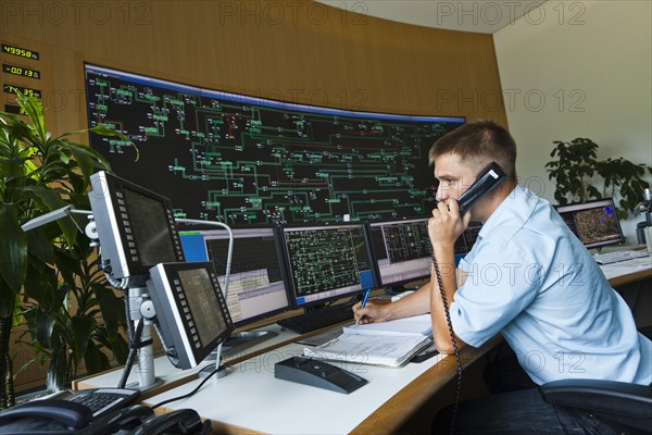 Engineer sitting at his work station in the Transmission Control Center