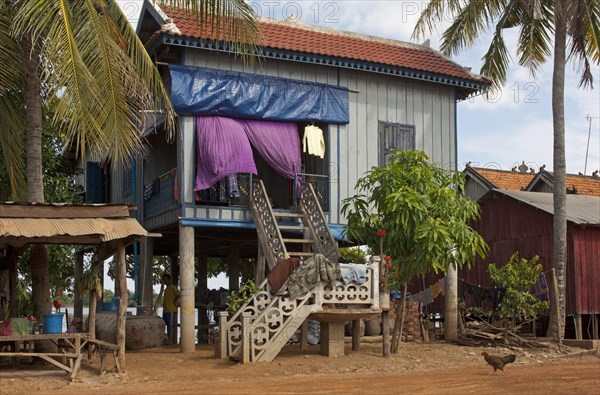 Stilt house on the banks of the Mekong River