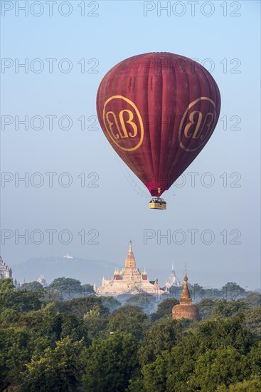 Hot air balloon over the landscape in morning light