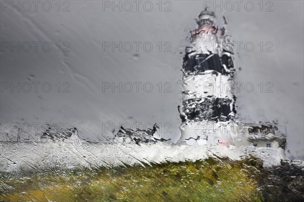 Hook Lighthouse through a rain-soaked pane of glass