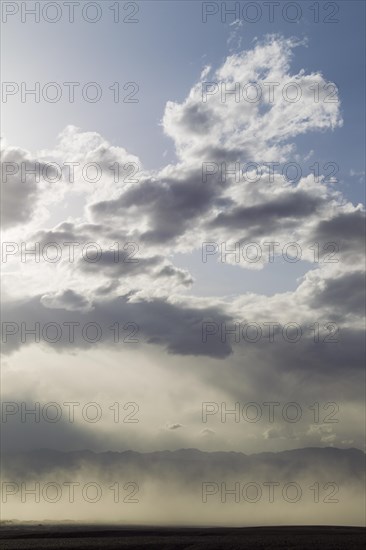 A sand storm over the Mesquite Flat Sand Dunes and the Panamint Range in the evening