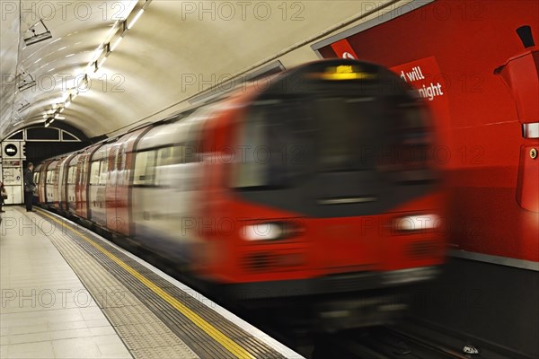 London underground train arriving at Charing Cross station