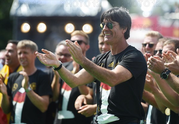 Joachim Low celebrates with fans