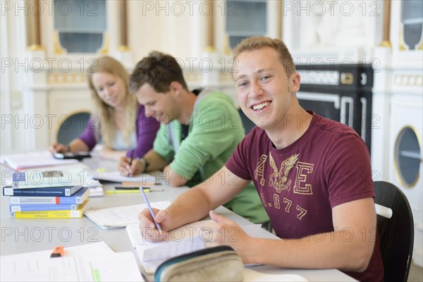 Students studying in the departmental library of the University of Hohenheim in Schloss Hohenheim Palace