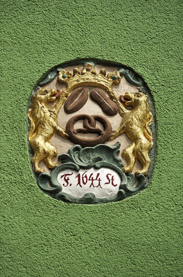 Guild sign of the bakers from 1644 on a bakery