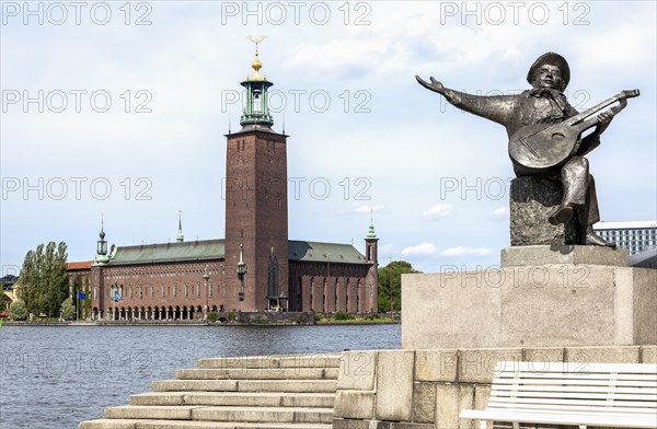 Sculpture of a lute player in front of Stockholm City Hall