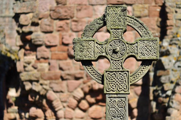 Celtic cross in the ruins of the Benedictine monastery of Lindisfarne