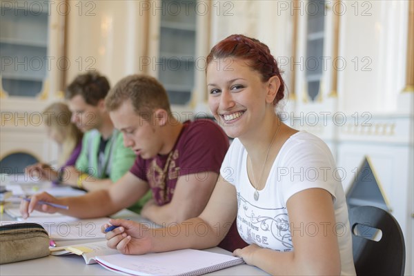 Students studying in the departmental library of the University of Hohenheim in Schloss Hohenheim Palace