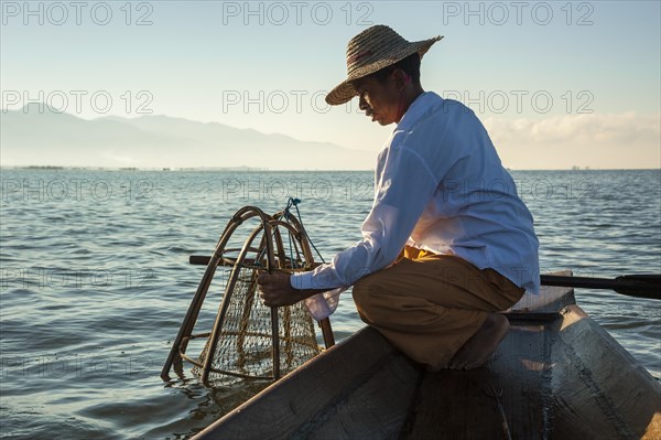 Fishermen with a traditional basket