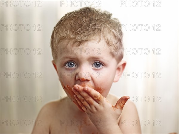 Toddler with a sauce-smeared face