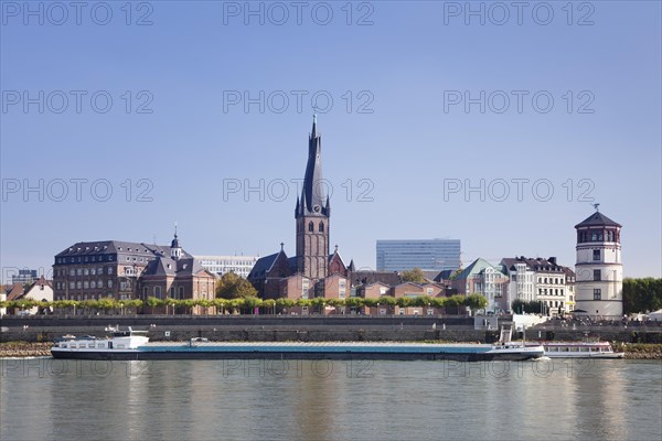 Dusseldorf's historic town centre with St. Lambertus Church and Schlossturm tower on the Rhine promenade