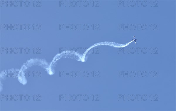 Airplane swirling through the sky