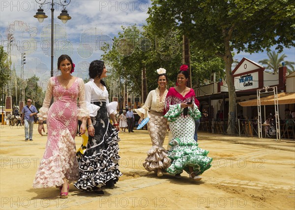 Women wearing gypsy dresses at the Feria del Caballo