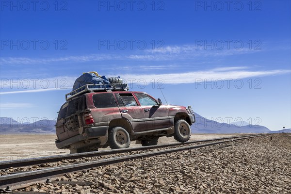 Car crossing railroad tracks