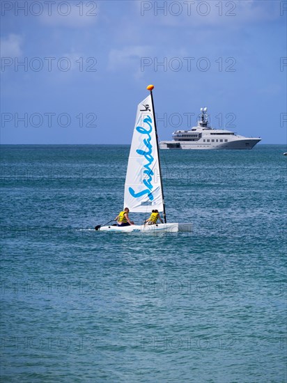 Catamaran and a motor yacht in Rodney Bay