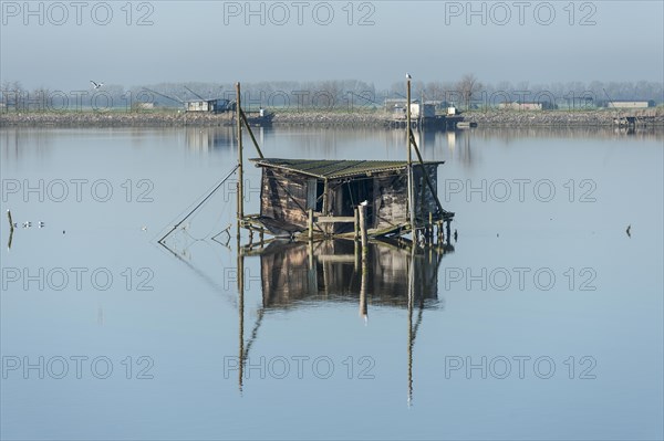 Dilapidated fishing hut in a lagoon