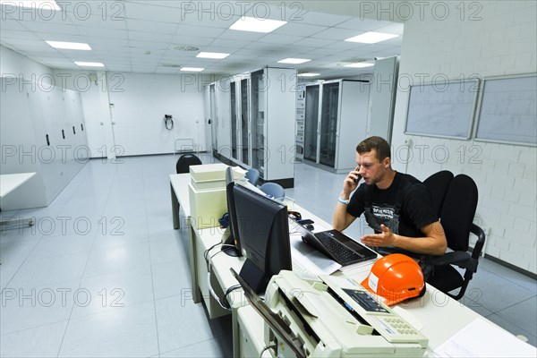 Electrician performing maintenance work on the substation premises of Transmission Control Center